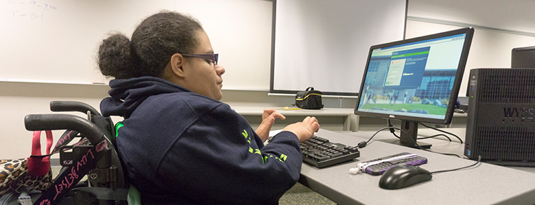 Photo of Highline College Access Services Student using assistive technology